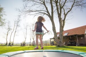 child on trampoline