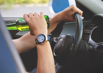 Drunk Driving Accident - Driver Behind the wheel drinking a beer