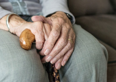 Elderly Hands Pictured - what to do if you suspect a loved one is the victim of nursing home abuse.