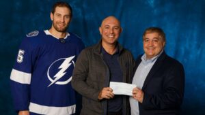 Tampa Bay Lightning Community Hero Marcus Fernandez of KFB Law with Tampa Bay Lightning owner Jeff Vinik