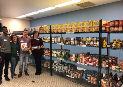 A group of volunteers in the Metropolitan Ministries food bank.