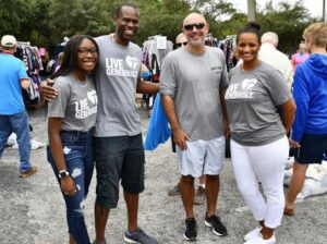 100 Meals Tampa Bay Founder Nik-kia with Marcus Fernandez, personal injury attorney, kinney, fernandez & boire PA