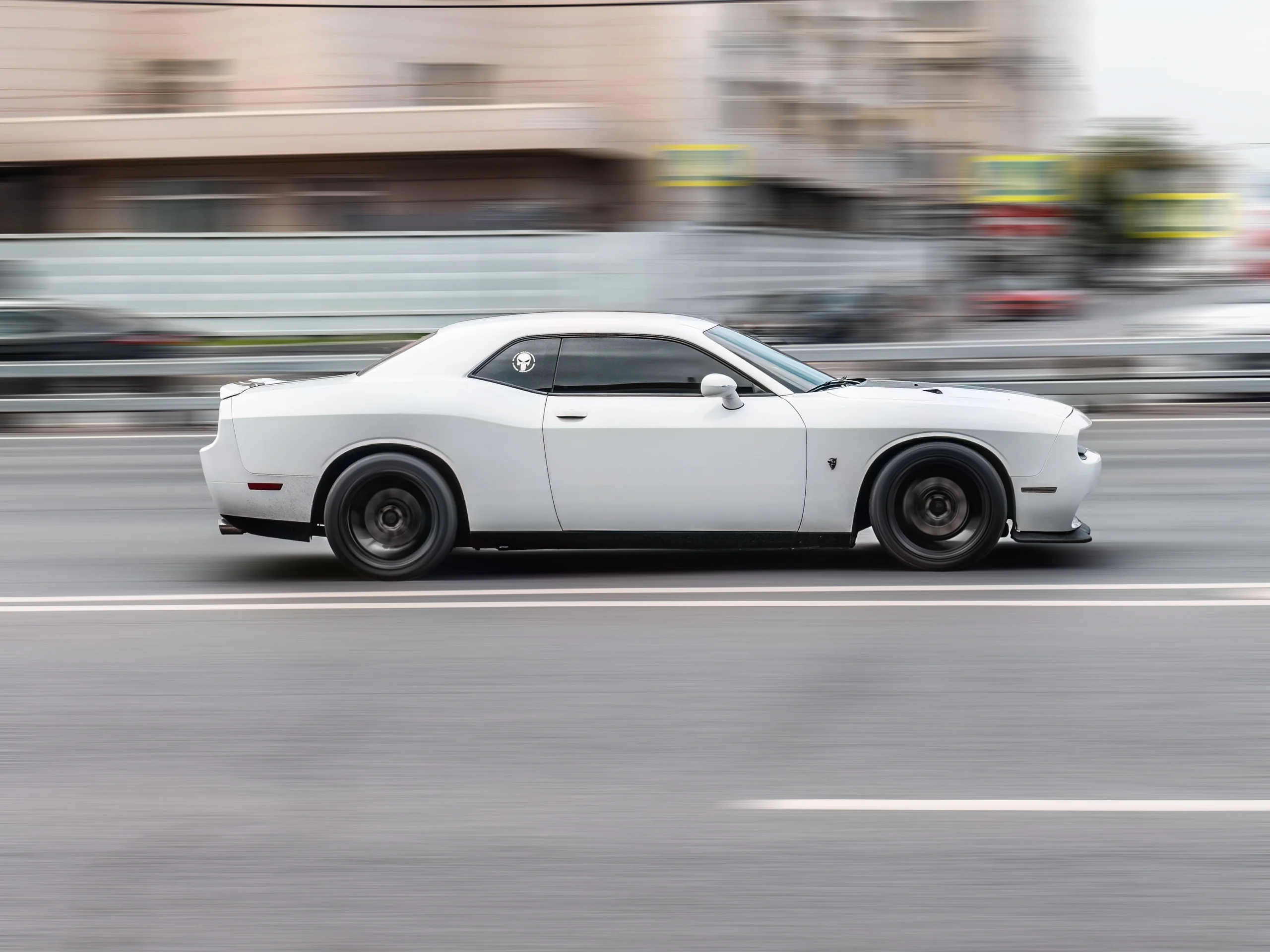 aggressive driver in muscle car drives too fast on florida highway